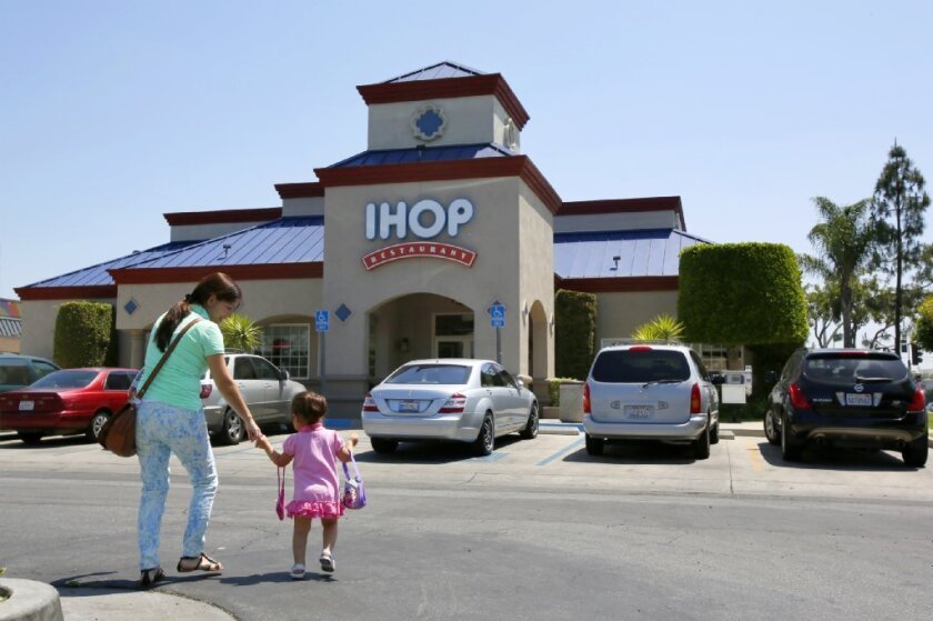 Customers outside an IHOP restaurant in Compton.