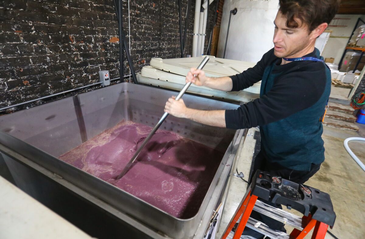 James Busch, production assistant at Pacific Coast Spirits mixes 100% blue corn whiskey mash in a fermenting tank, that when distilled, will become their California Blue Corn Whiskey. Photographed, January 29, 2020 in Oceanside, California.