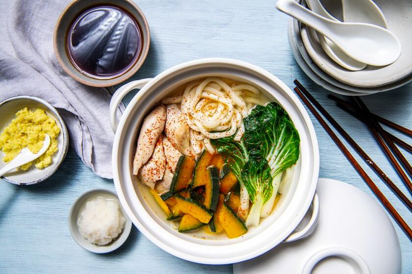This one-pot soup combines chicken with noodles and winter squash. Prop styling by Kate Parisian.