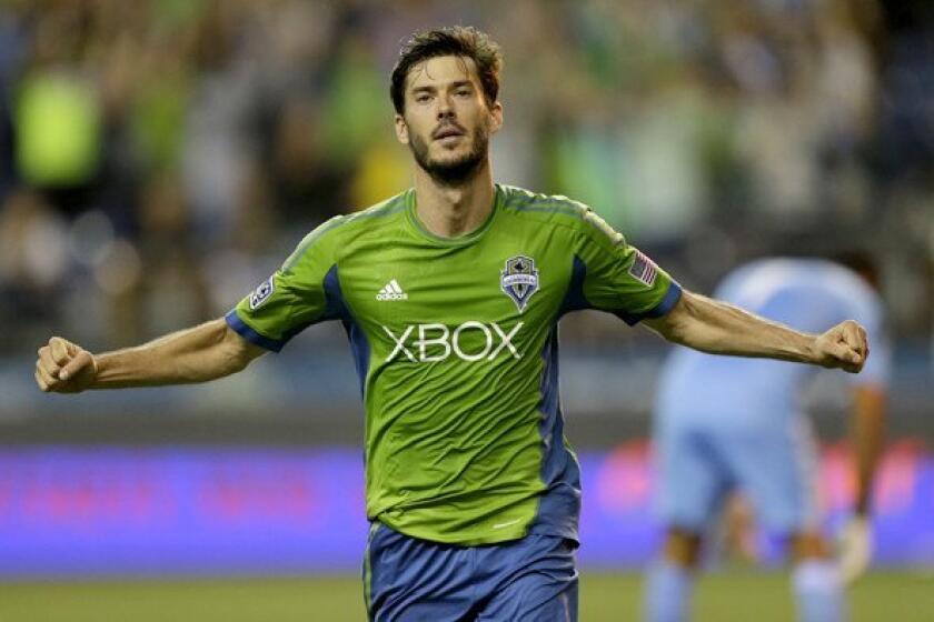 Brad Evans, celebrating after scoring a goal for the Sounders last month, has been hobbled by a strained calf.