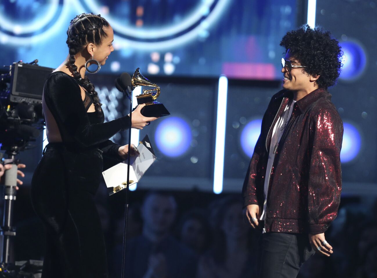 Alicia Keys presents the award for record of the year to Bruno Mars for "24K Magic."