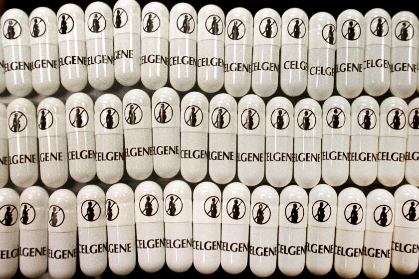 FILE - This April 7, 1998 file photo shows capsules of the drug thalidomide at the Celgene Corp. in Warren, N.J, printed with a symbol warning pregnant or soon-to-be pregnant women against use of the drug that had caused thousands of infant deformities. Celgene has agreed to pay $280 million to settle a federal lawsuit alleging it committed fraud by promoting a drug for leprosy and another therapy for unapproved cancer treatments, federal prosecutors announced Tuesday, July 25, 2017. (AP Photo/Mike Derer, File)