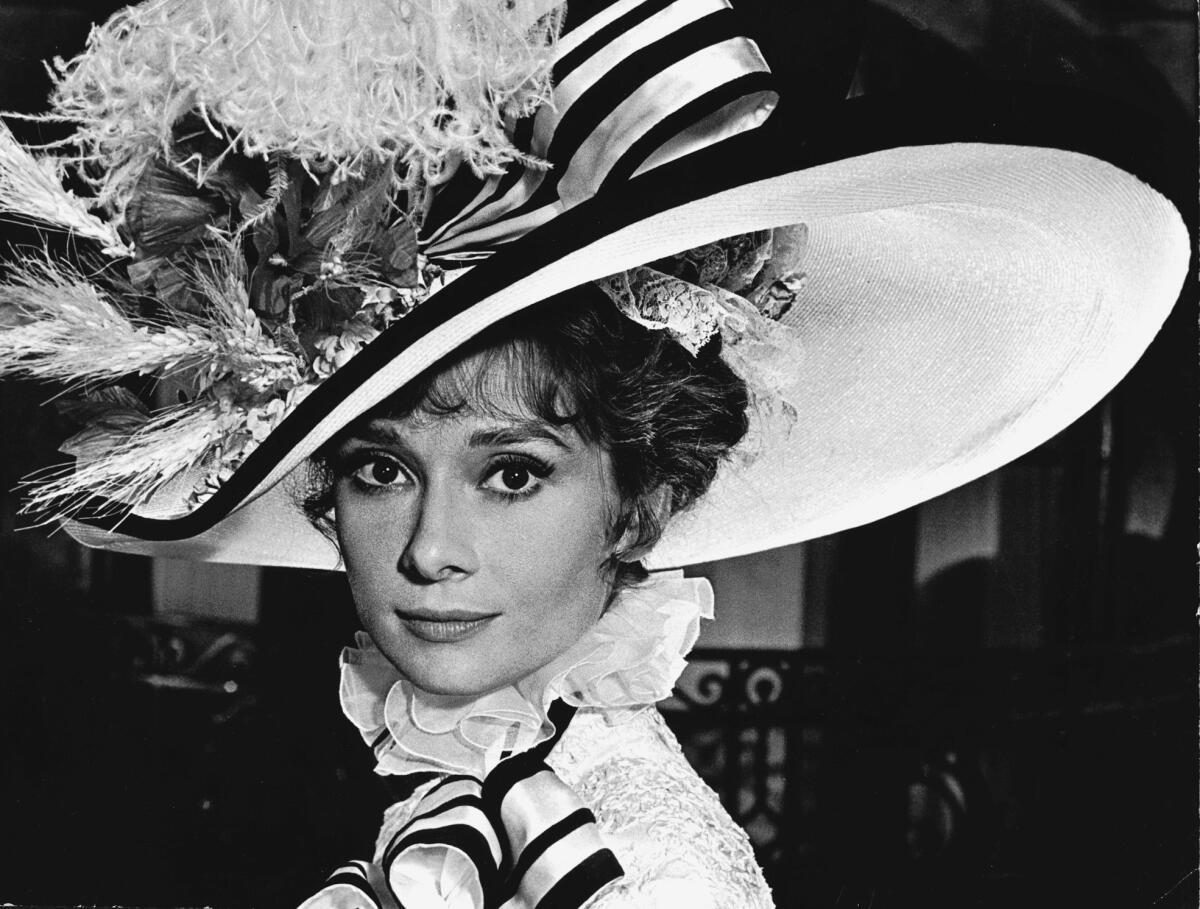 Audrey Hepburn wears a huge hat as Eliza Doolittle in "My Fair Lady"