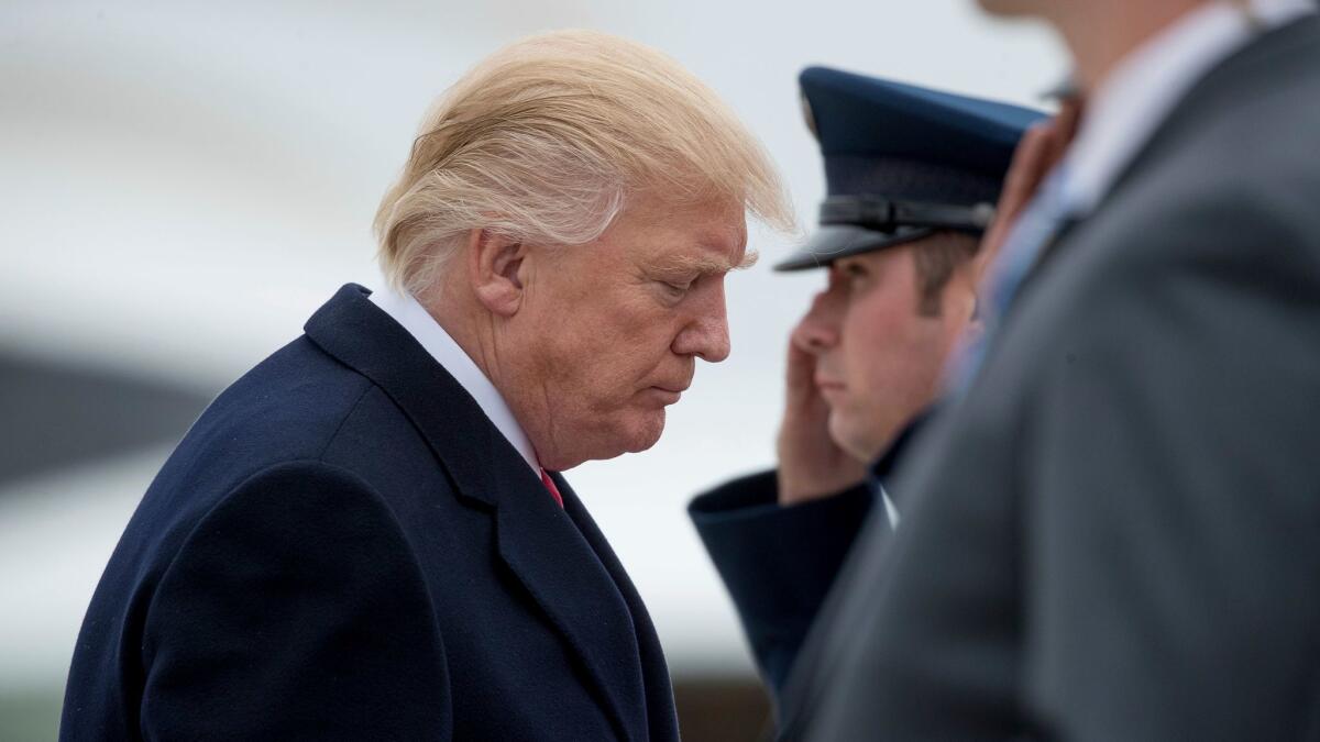 President Donald Trump boards Air Force One at Andrews Air Force Base, Md. on March 20. (Andrew Harnik / Associated Press)