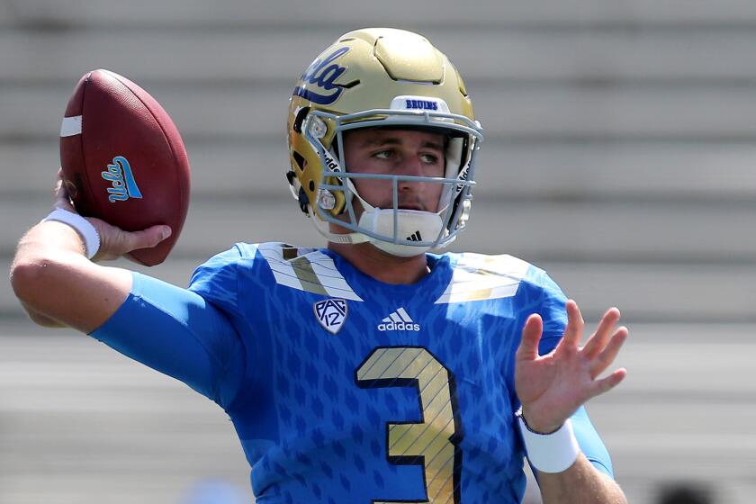 UCLA quarterback Josh Rosen warms up before the game against Virginia at the Rose Bowl.