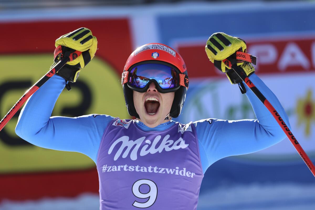 Italy's Federica Brignone celebrates at finish area after completing an alpine ski, women's World Cup super-G race in Zauchensee, Austria, Sunday, Jan. 16, 2022. (AP Photo/Marco Trovati)