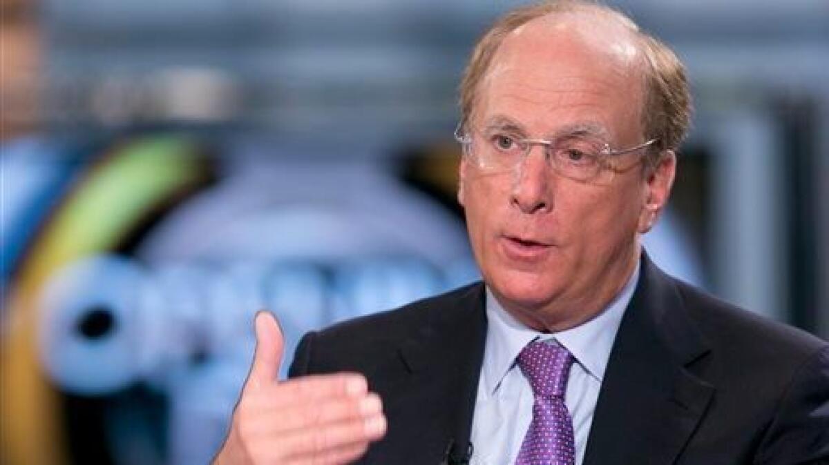 Larry Fink, chief executive of money management giant BlackRock Inc., shown in 2014, thinks businesses need to think more about how they’re going to grow and compete. (Mark Lennihan / Associated Press)
