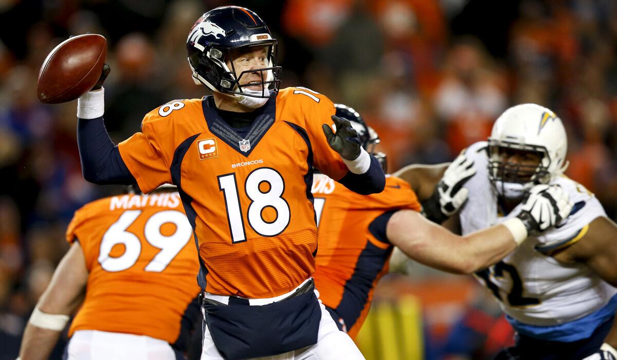 Denver Broncos quarterback Peyton Manning passes during the second half against the San Diego Chargers on Sunday.