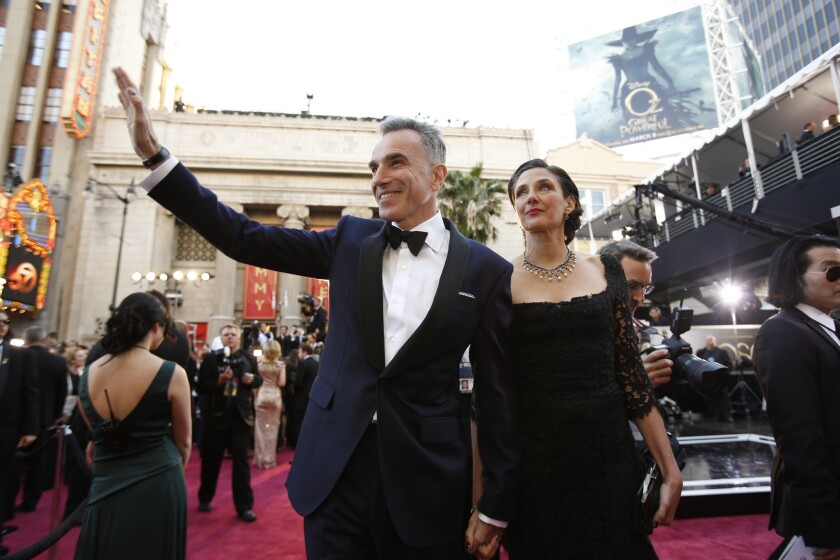 Actor Daniel Day-Lewis wears Domenico Vacca as he arrives with his wife, writer-director Rebecca Miller, at the Academy Awards in February 2013. (He won for "Lincoln.")