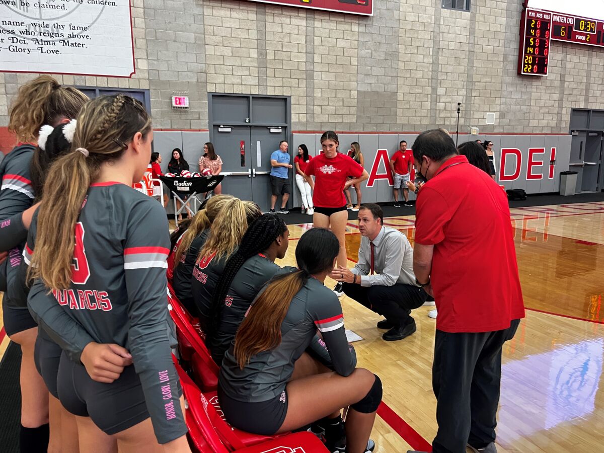 Mater Dei girls' volleyball coach Dan O’Dell talks to his team.
