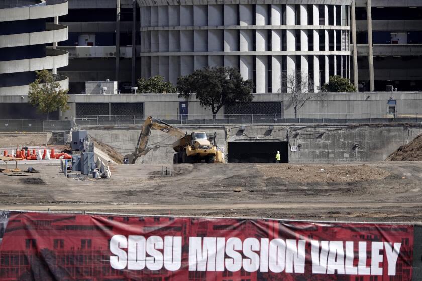 SAN DIEGO, CA - SEPTEMBER 21: Construction continues at the SDSU Mission Valley site west of SDCCU stadium on Monday, Sept. 21, 2020 in San Diego, CA. The asphalt parking lot is being removed and earth movers have been busy at work. (K.C. Alfred / The San Diego Union-Tribune)