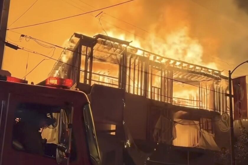 One person is in critical condition after being rescued from a raging fire at a vacant three-story apartment building under construction in the 800 block of N. Bunker Hill Ave. in Chinatown early Friday, Sept. 13, 2024. Fire crews encountered intense flames burning on the first and third floors of the vacant building and had spread to two nearby apartment buildings, LAFD spokeswoman Margaret Stewart said.