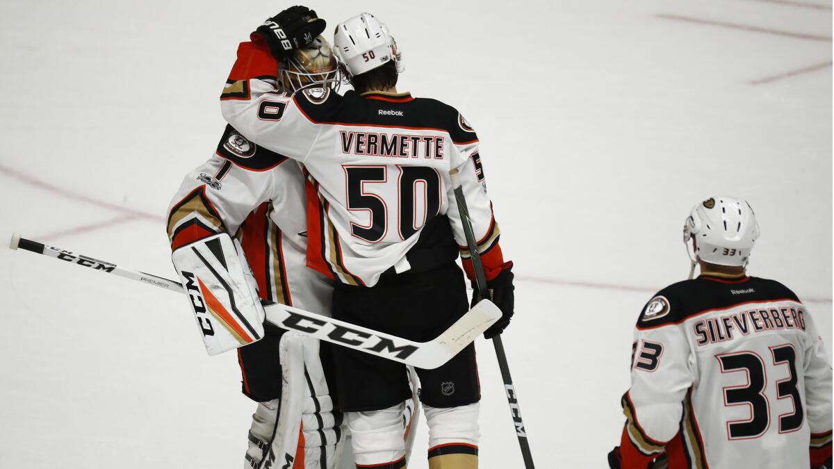 Ducks center Antoine Vermette consoles goalie Jonathan Bernier after losing to the Predators.