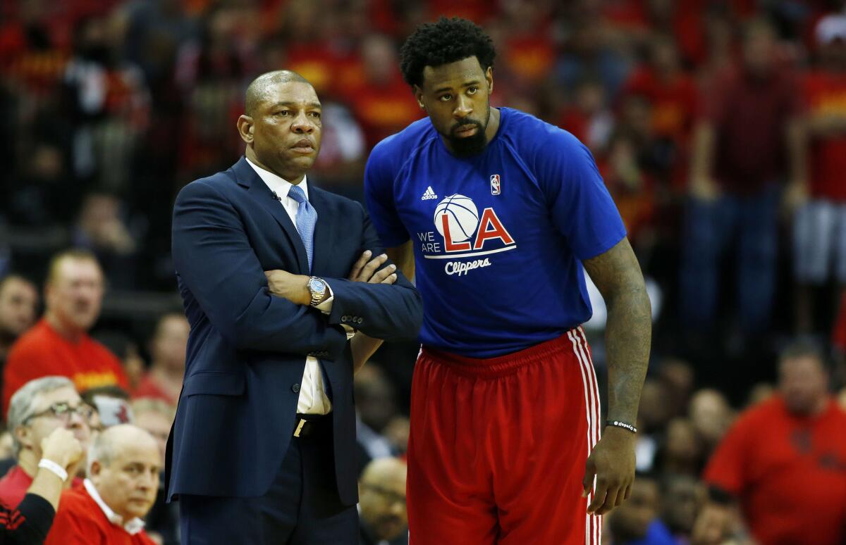Clippers Coach Doc Rivers and DeAndre Jordan meet during Game 7 of the Western Conference semifinals against Houston in May.