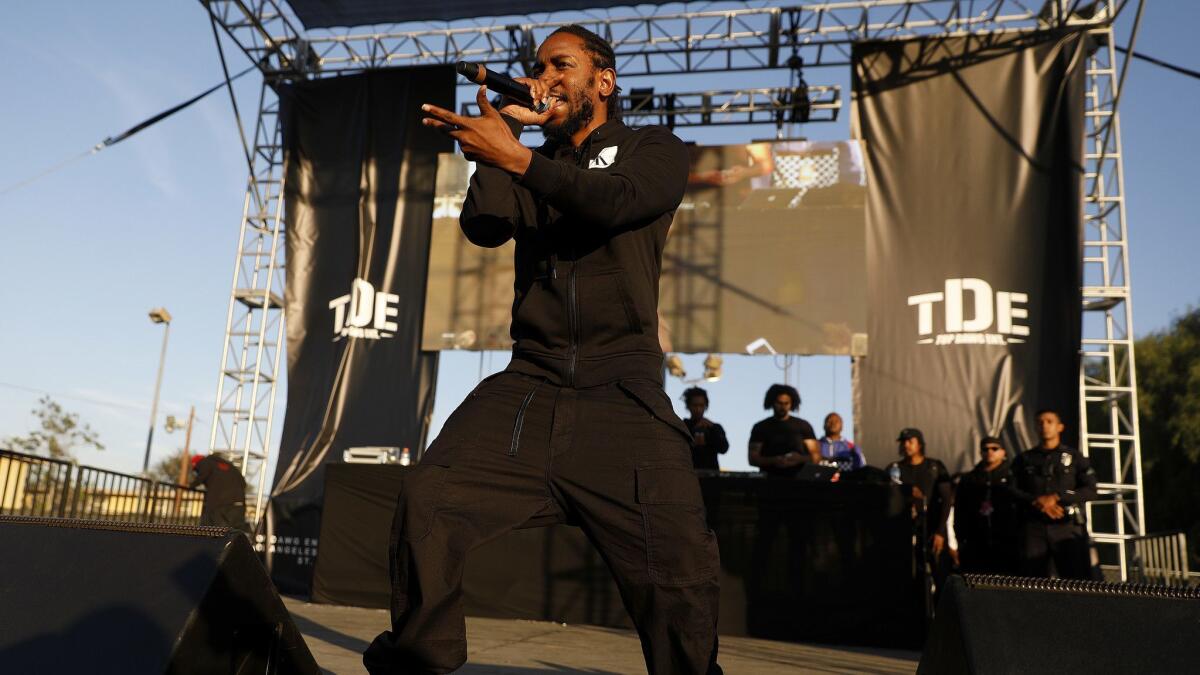 Kendrick Lamar performs at the fifth annual Nickerson Gardens Christmas Concert and Toy Drive put on by Top Dog Entertainment in Los Angeles, Calif., on Dec. 19, 2018.