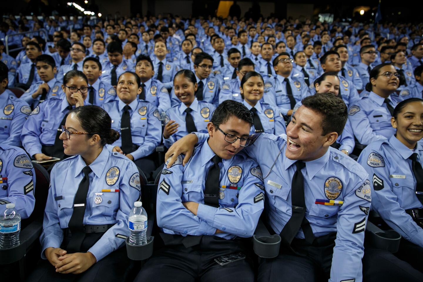 New LAPD cadets enjoy themselves at a graduation ceremony at USC's Galen Center on Saturday.