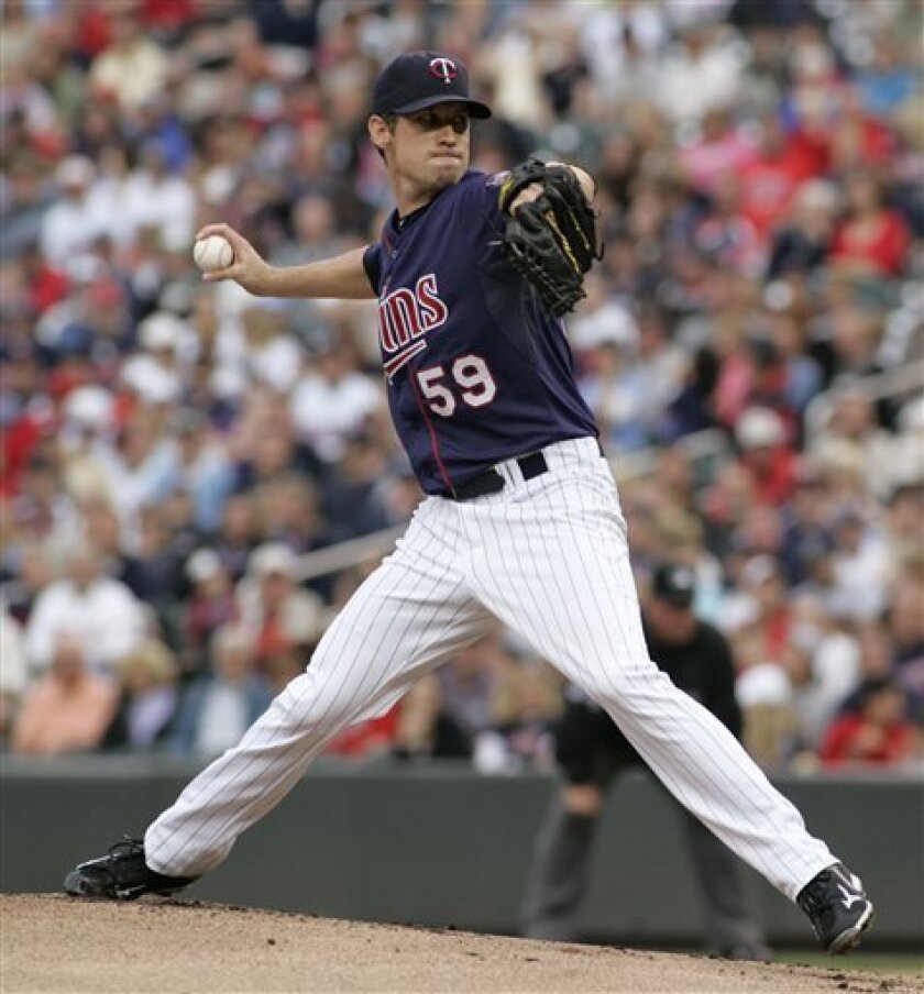 Minnesota Twins starting pitcher Kevin Slowey delivers against the Kansas City Royals during the first inning of a baseball game, Monday Sept. 6, 2010 in Minneapolis. (AP Photo/Paul Battaglia)