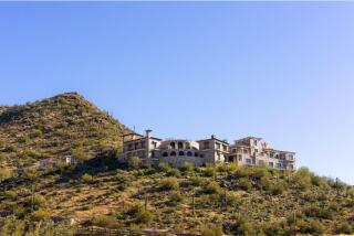 Built in 2021, the scenic mega-mansion is called Altitude and sits atop a peak overlooking Scottsdale and the surrounding mountains.