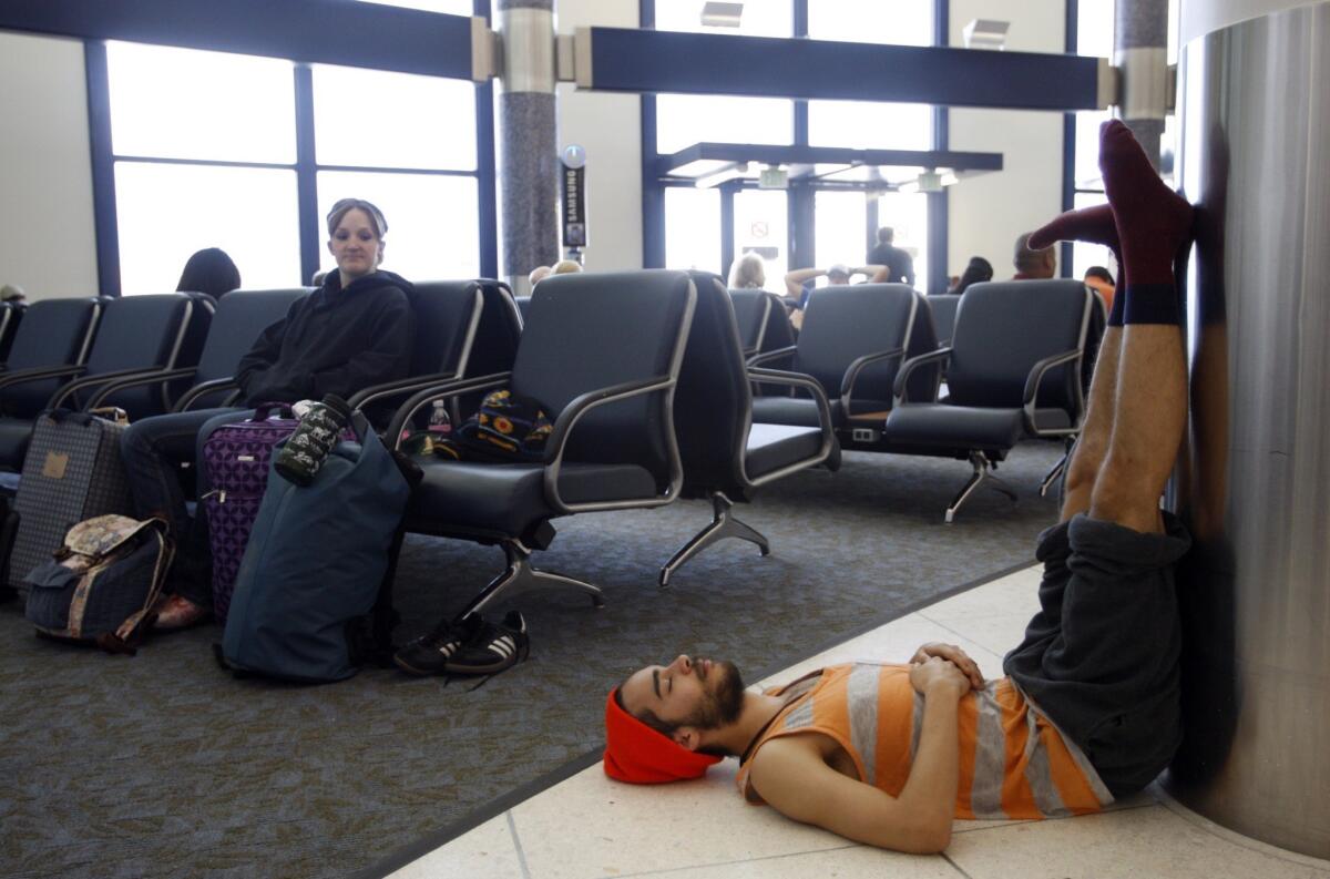 Nicholas Daulton, 22, relaxes at the newly remodeled Terminal 6 at the Los Angeles International Airport.
