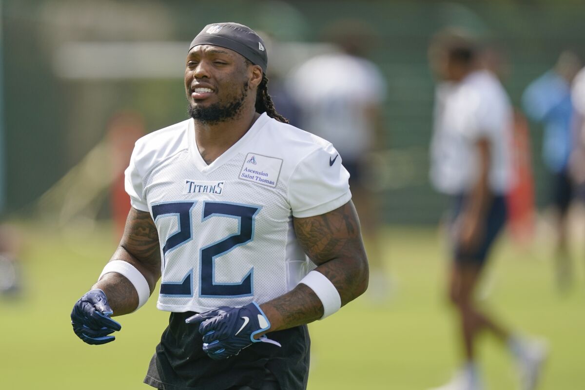 Tennessee Titans running back Derrick Henry warms up at the NFL football team's practice facility Tuesday, June 14, 2022, in Nashville, Tenn. (AP Photo/Mark Humphrey)