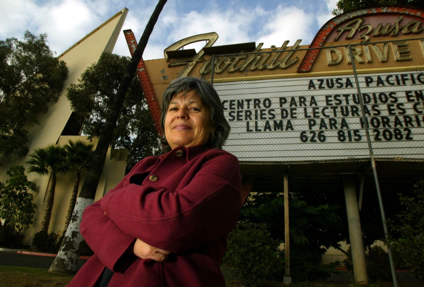 Christina Cruz-Madrid, then the mayor of Azusa, stands in front of the shuttered Azusa Foothill Drive-In.