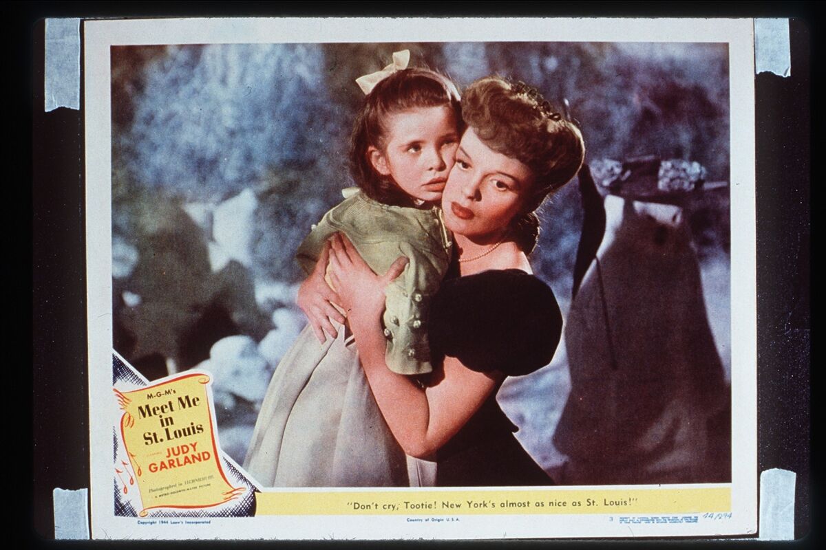 Judy Garland hugs Margaret O'Brien in an MGM photo for "Meet Me in St. Louis," whose 75th anniversary is being marked with screenings in theaters. 