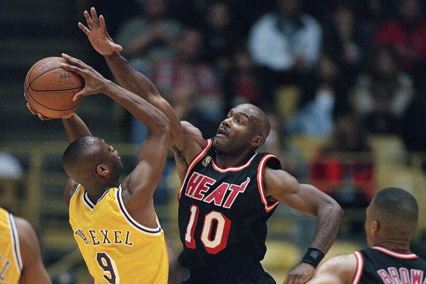 FILE - Miami Heat's Tim Hardaway defends against a shot by Los Angeles Lakers Nick Van Exel during an NBA basketball game at the Forum in Inglewood, Calif., Jan. 10, 1997. Hardaway is among this year's group of finalists for induction into the Naismith Memorial Basketball Hall of Fame. (AP Photo/Michael Caulfield. File)