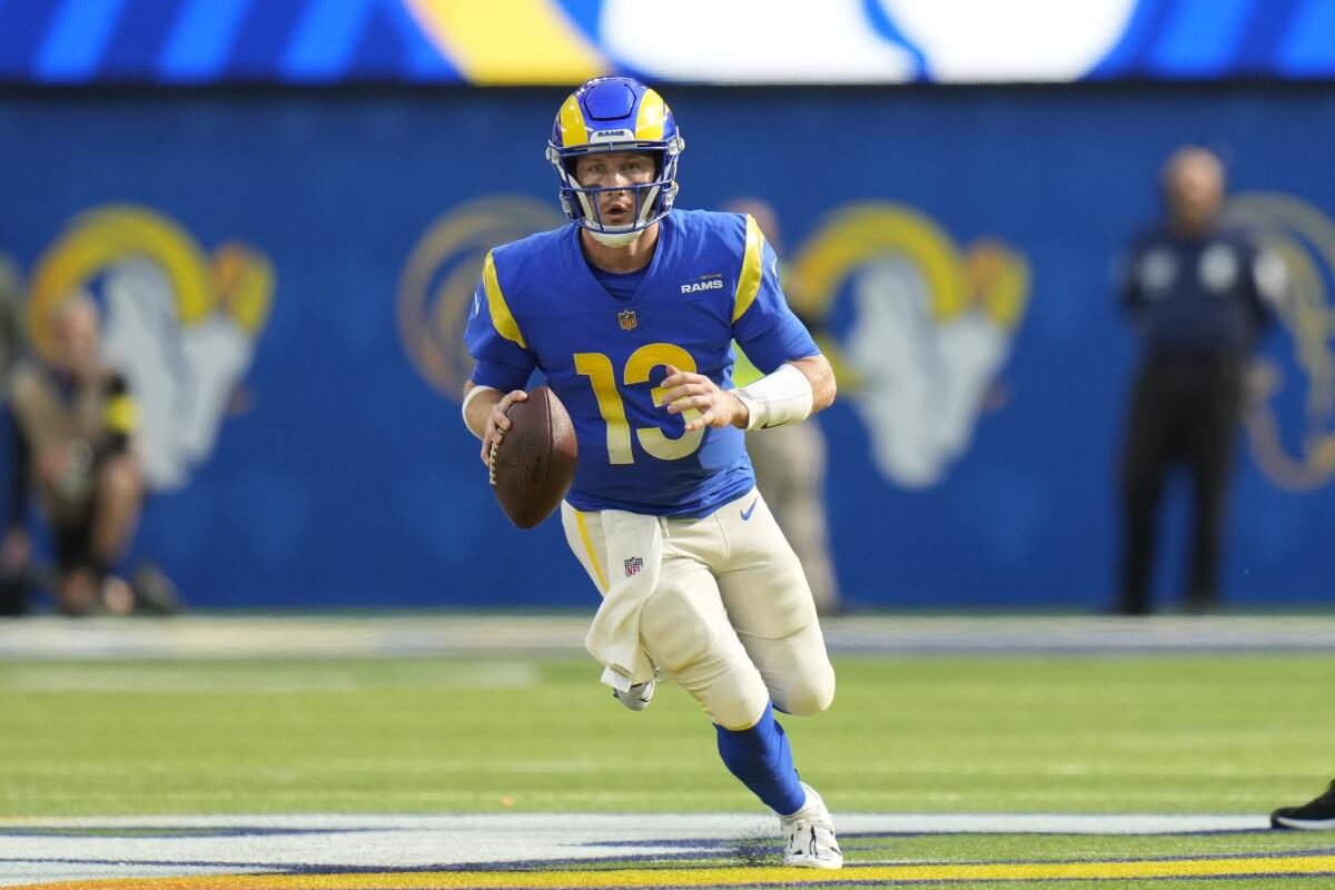 Rams quarterback John Wolford runs the ball against the Arizona Cardinals on Nov. 13.