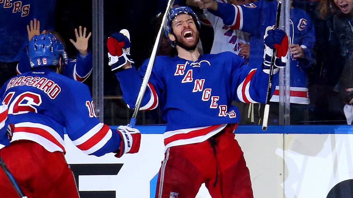 New York Rangers forward Dominic Moore celebrates after scoring a go-ahead goal in the third period of a 2-1 win over the Tampa Bay Lightning in Game 1 of the Eastern Conference finals on Saturday.