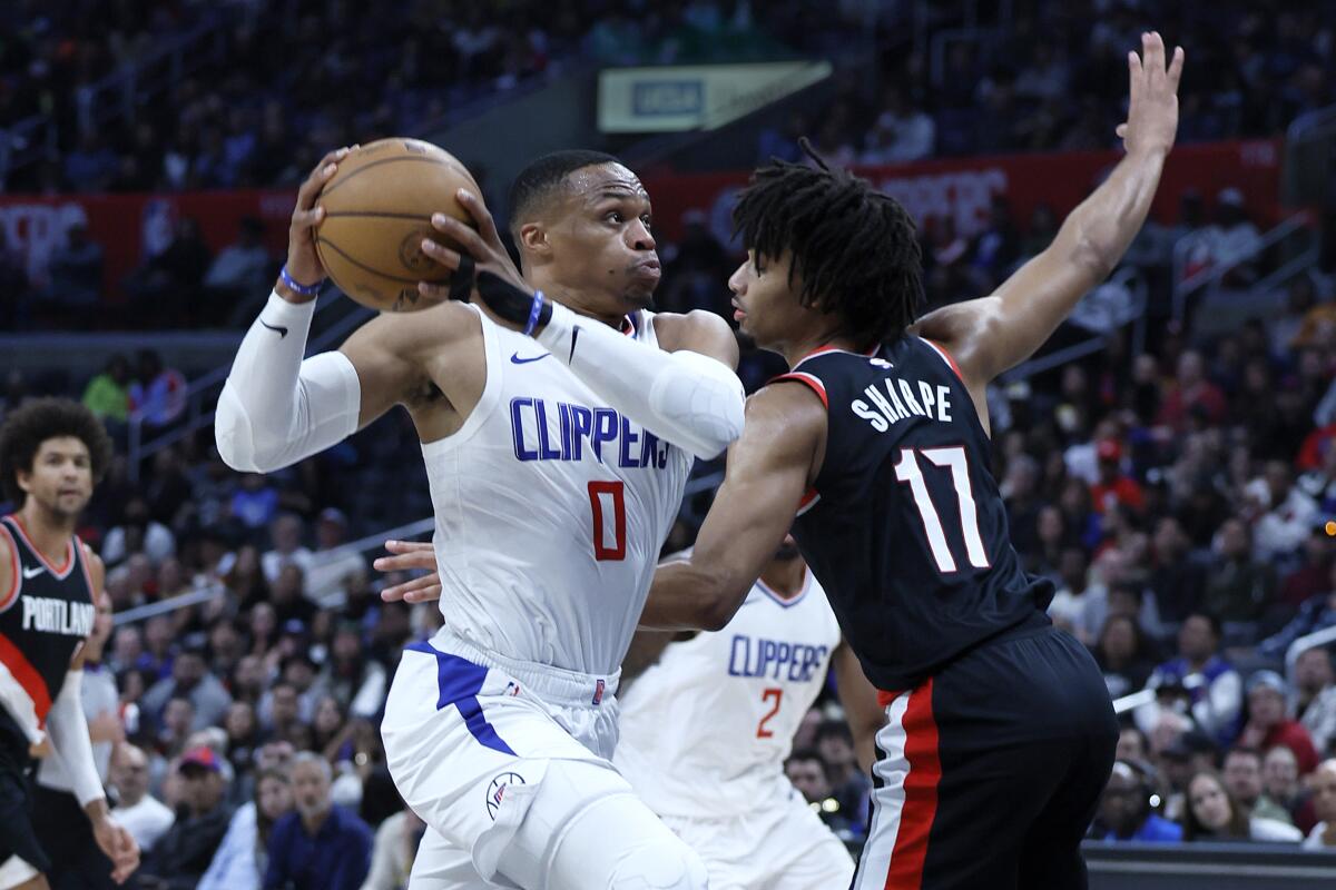 Russell Westbrook drives to the basket in front of Trail Blazers guard Shaedon Sharpe.