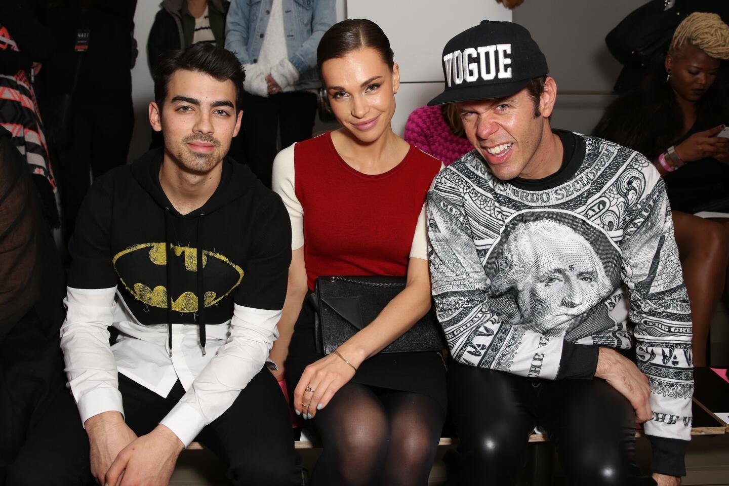 Joe Jonas, Blanda Eggenschwiler and Perez Hilton attend the The Blonds fashion show.