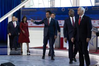 SIMI VALLEY, CA - SEPTEMBER 27: GOP Presidential candidates Chris Christie, left, Doug Burgum, Nikki Haley, Vivek Ramaswamy, Ron Desantis, Tim Scott and Mike Pence take the stage at the second GOP debate held at the Ronald Reagan Presidential Library in Simi Valley, CA on Wednesday, Sept. 27, 2023. (Myung J. Chun / Los Angeles Times)