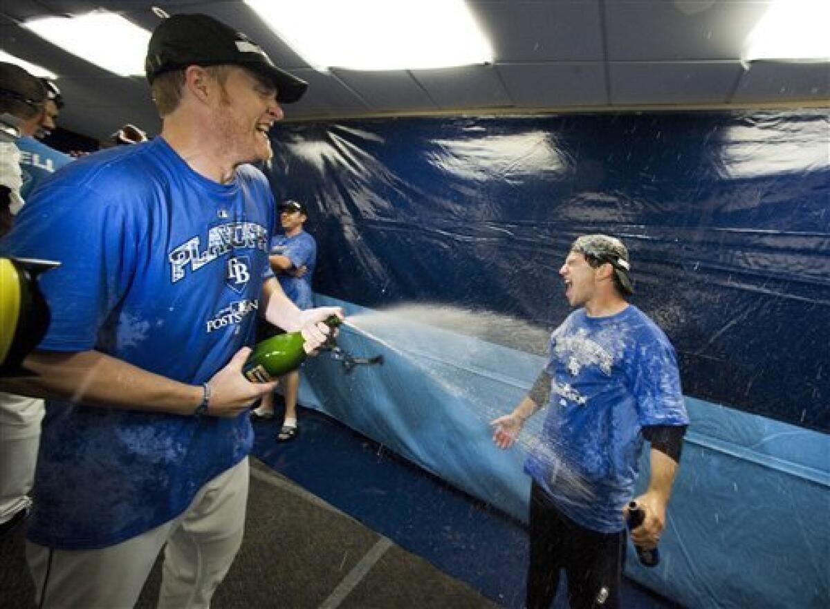 amid-sprays-champagne-yankees-celebrate-postseason-clincher