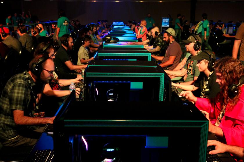 BlizzCon attendees playing Hearthstone. (Photo by Noah Smith for The Washington Post via Getty Images)