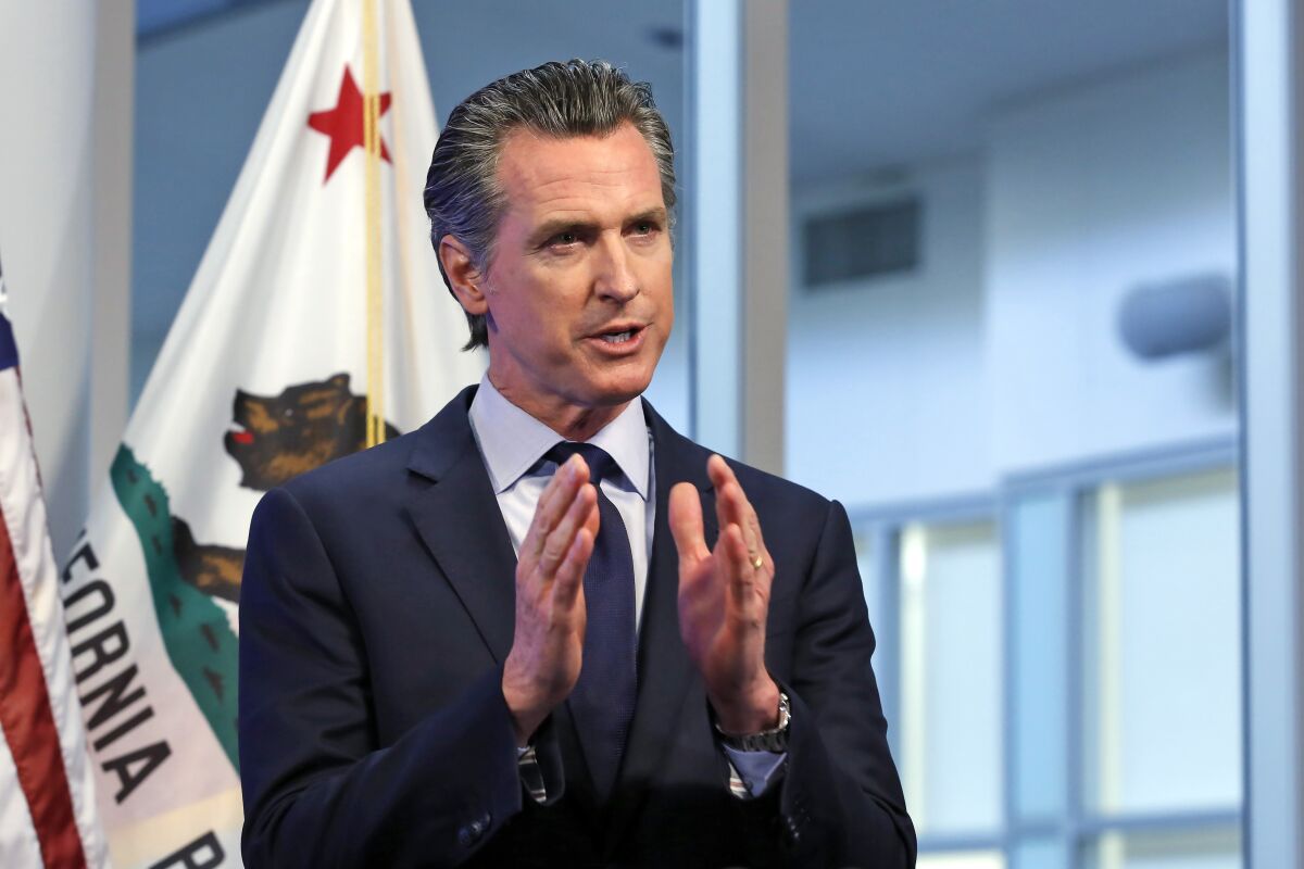 California Gov. Gavin Newsom discusses at an April 14 news conference an outline for what it will take to lift coronavirus restrictions.