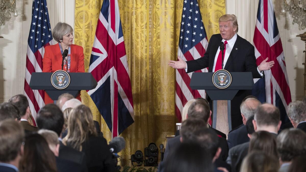 British Prime Minister Theresa May and President Trump address the media during her visit to Washington, D.C., last year. Trump has canceled a visit to Britain saying he was not a "big fan" of the new U.S. embassy in London.