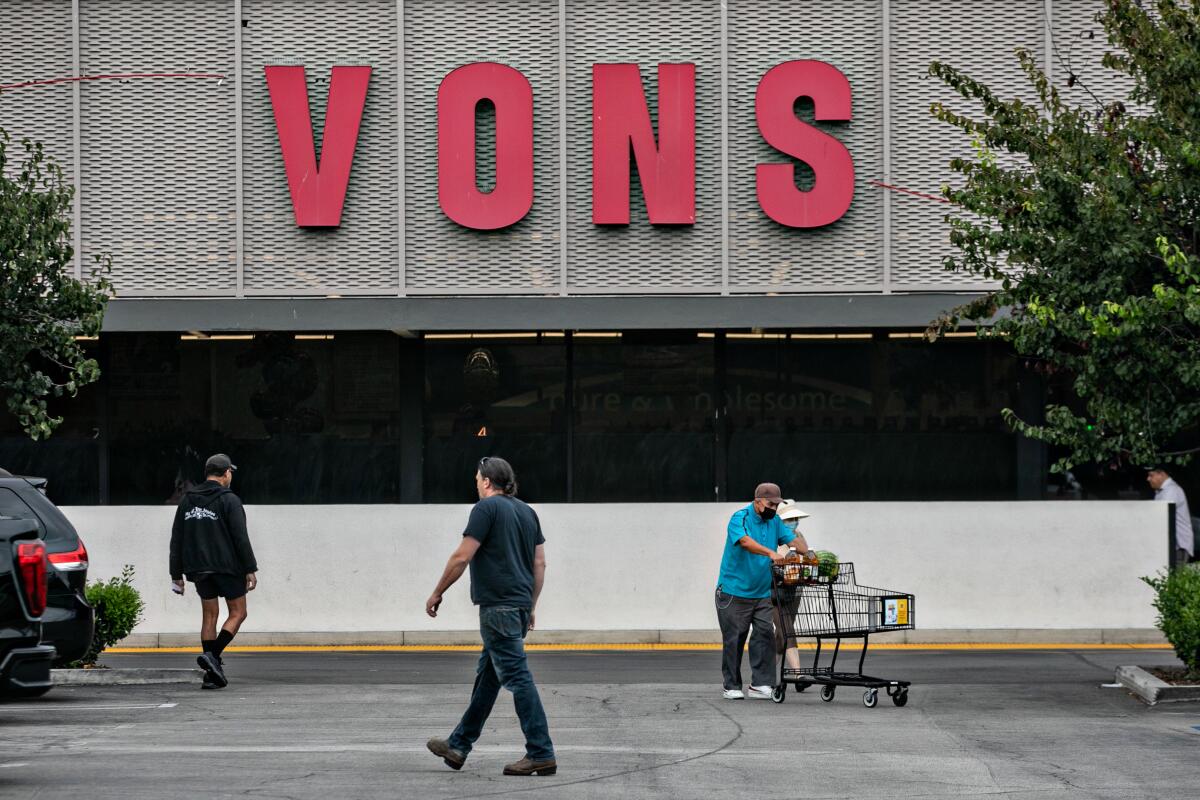Shoppers outside a Vons.