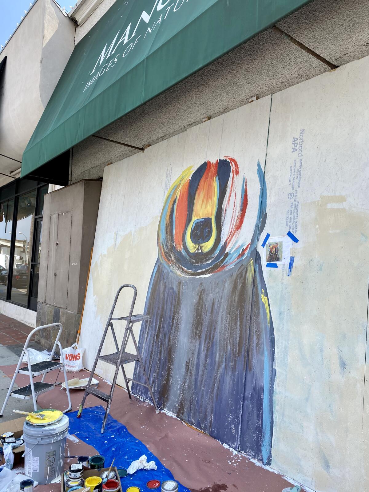 A mural on the Prospect Street side of Mangelsen Images of Nature Gallery is pictured in progress.