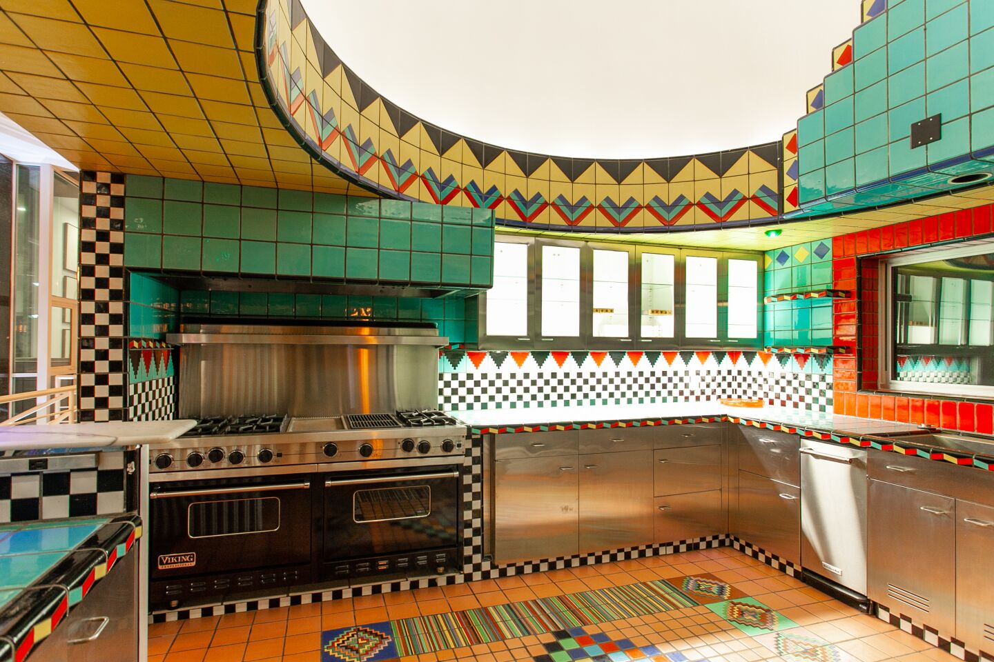 Original mosaic tile work in the kitchen reflects the original owner’s love of the medium.