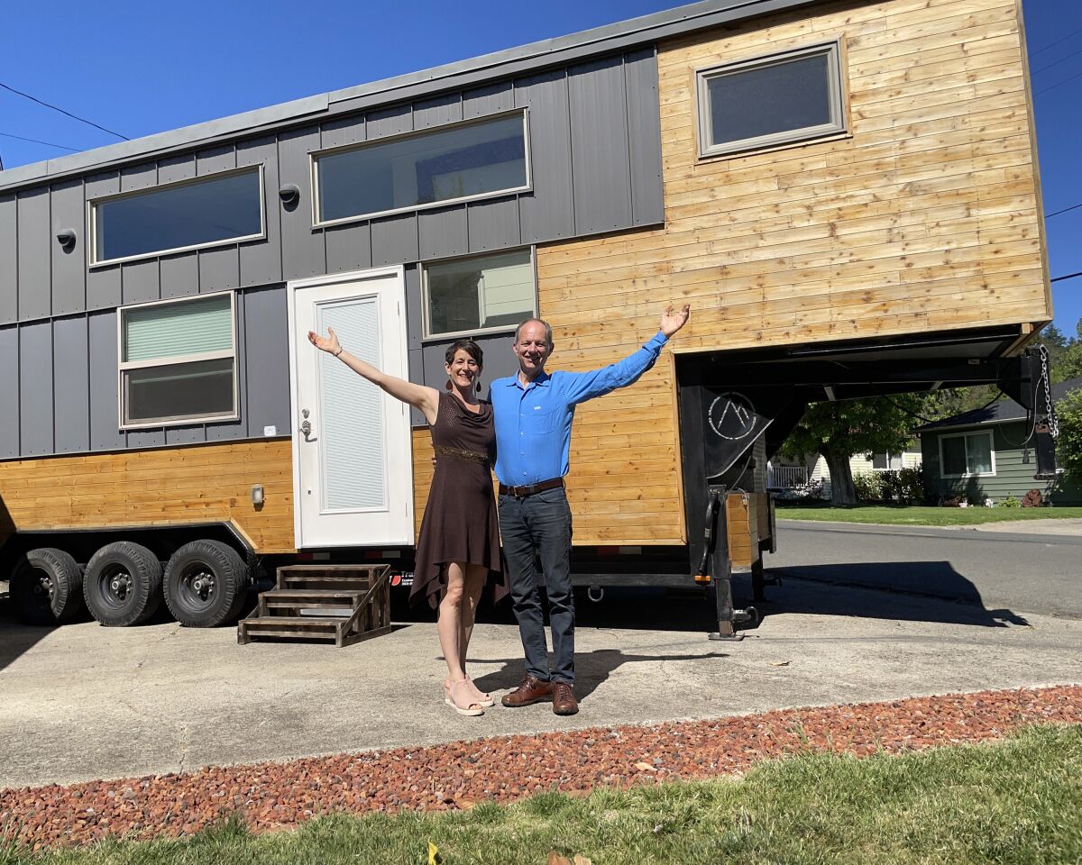 Lindsay and Eric Wood, founders of Experience Tiny Homes of San Diego, in front of their home. They will speak at TinyFest.