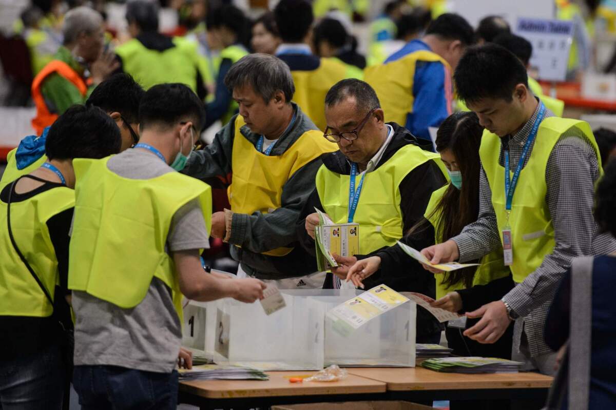 Electoral officials count votes that were cast for the Legislative Council election at the central counting station in Hong Kong on Sept. 5.