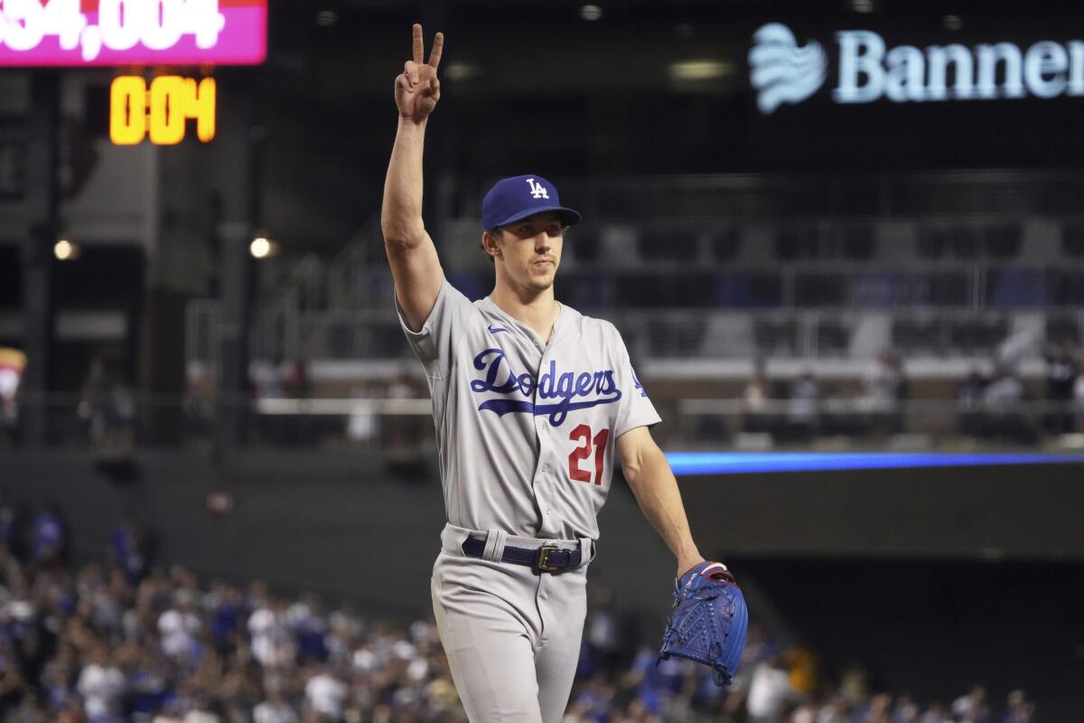 Los Angeles Dodgers pitcher Walker Buehler acknowledges fans while leaving in the eighth inning.