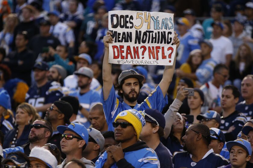 A fan shares his feelings from the stands as the Chargers play the Miami Dolphins in what could be the team's final game in San Diego, on Dec. 20.