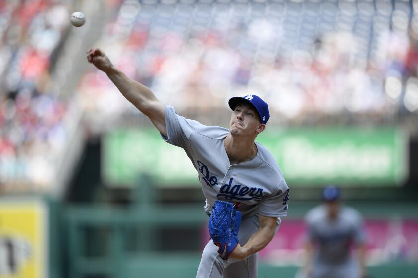 Los Angeles Dodgers starting pitcher Walker Buehler delivers during the first inning of a baseball game against the Washington Nationals, Sunday, July 28, 2019, in Washington. (AP Photo/Nick Wass)