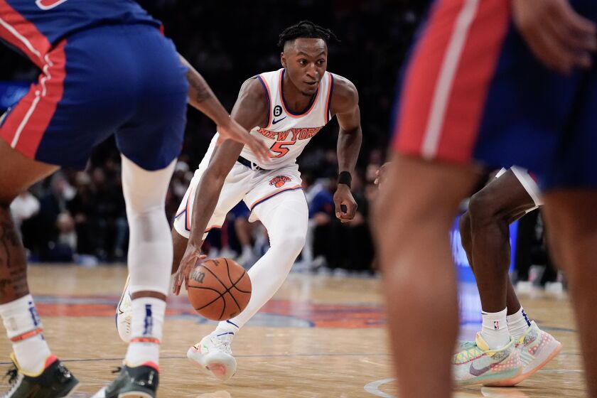 New York Knicks guard Immanuel Quickley (5) drives the ball during the second half of a preseason NBA basketball game against the Detroit Pistons, Tuesday, Oct. 4, 2022, in New York. (AP Photo/Julia Nikhinson)