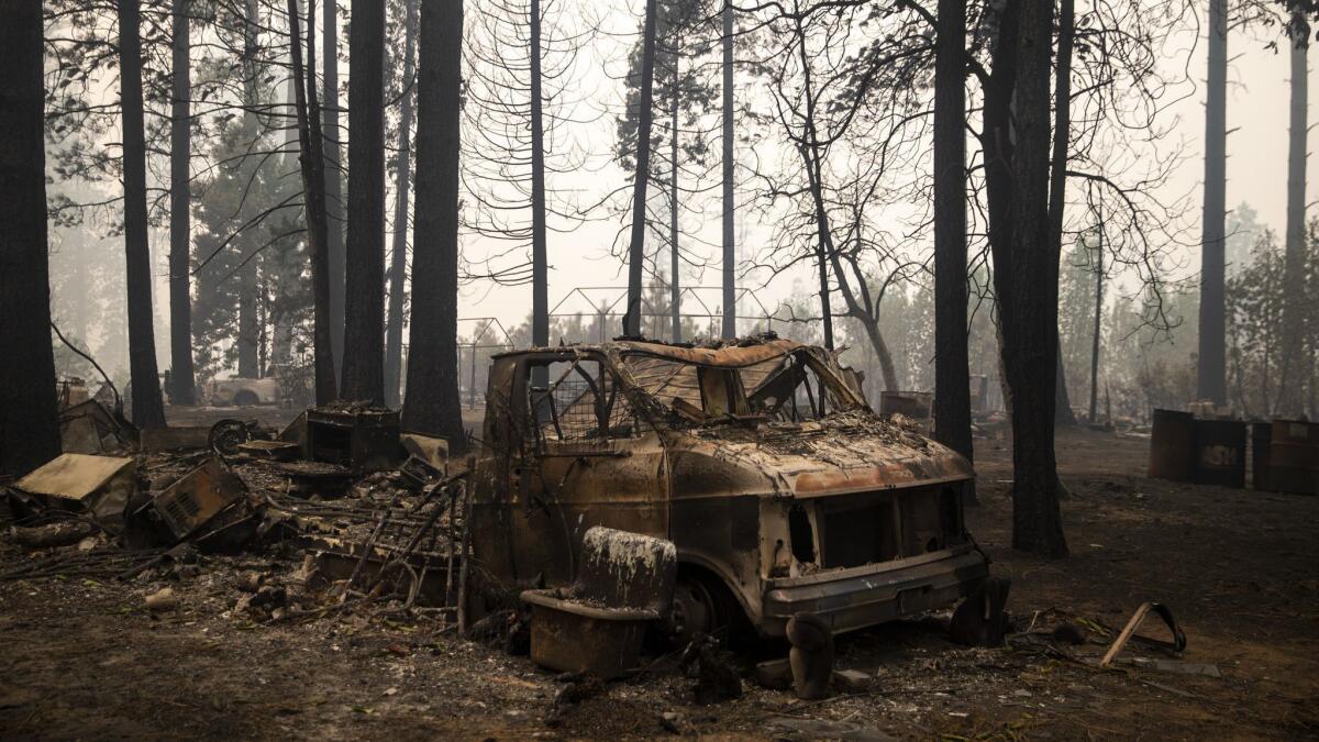 The remains of a vehicle at the campgrounds near Concow Reservoir after the Camp fire swept through the area.