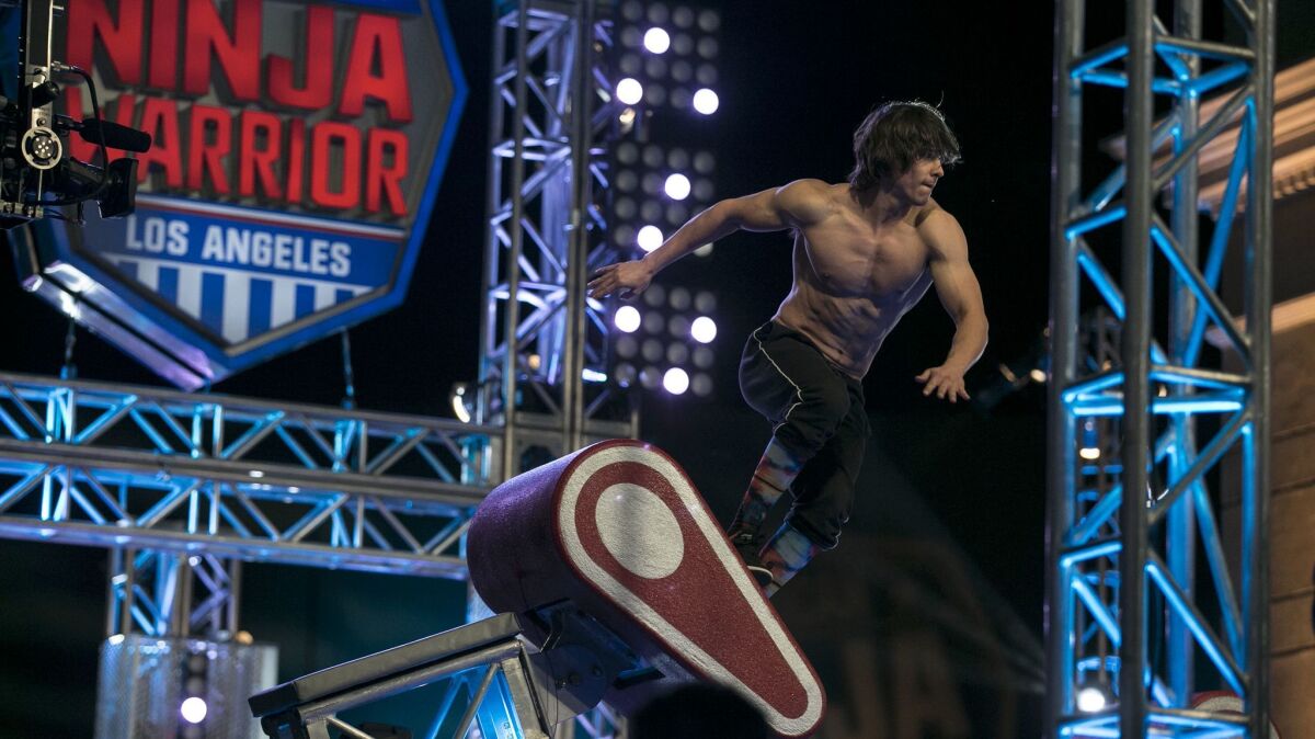 Athletes and even journalists tackle the labyrinthine "American Ninja Warrior" obstacle course in a challenge that brings out the best in competitors.