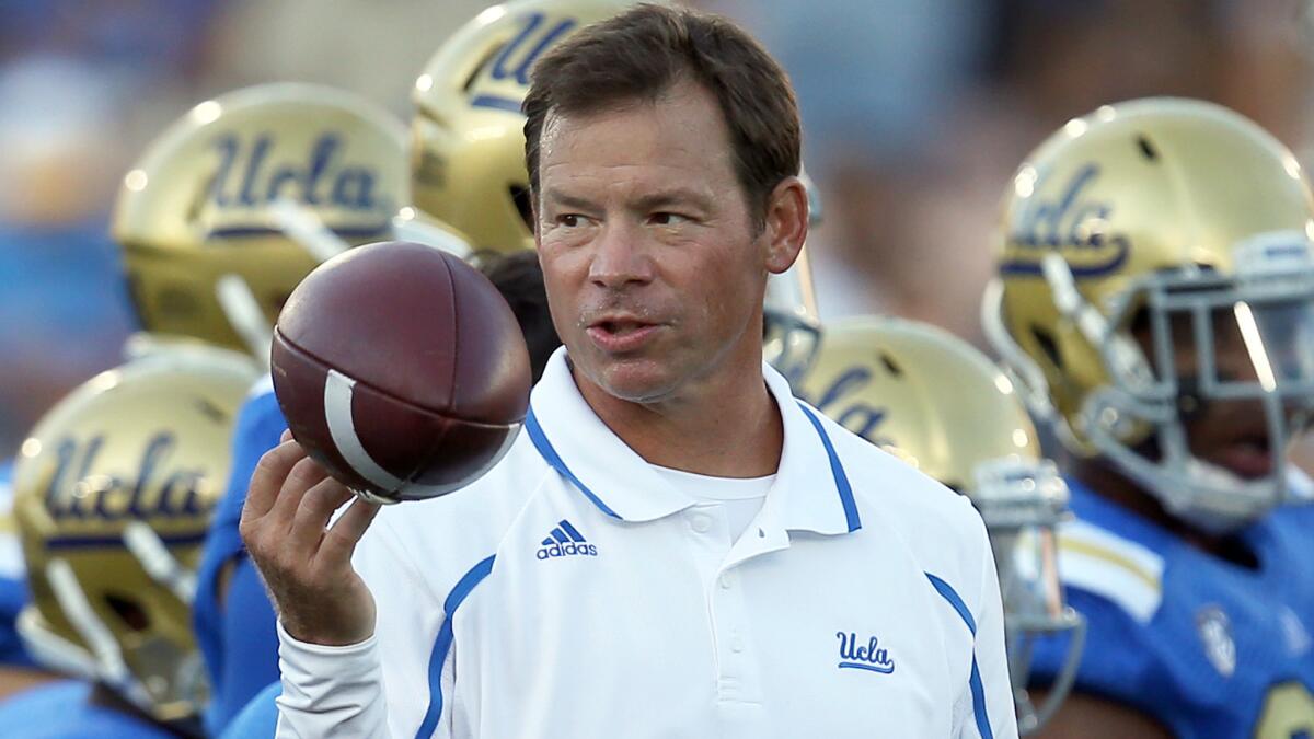 UCLA Coach Jim Mora looks on during the Bruins' 2013 season opener against Nevada at the Rose Bowl.