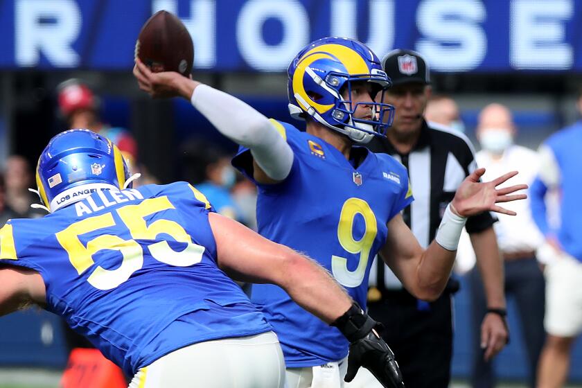 INGLEWOOD, CALIF. - OCT. 24, 2021. Rams quarterback Matthew Stafford throws a pass against the Lions.