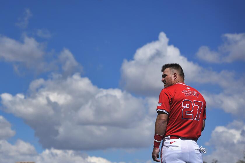 Los Angeles Angels' Mike Trout warms up prior to a spring training baseball game against the Colorado Rockies, Friday, March 8, 2024, in Tempe, Ariz. (AP Photo/Matt York)